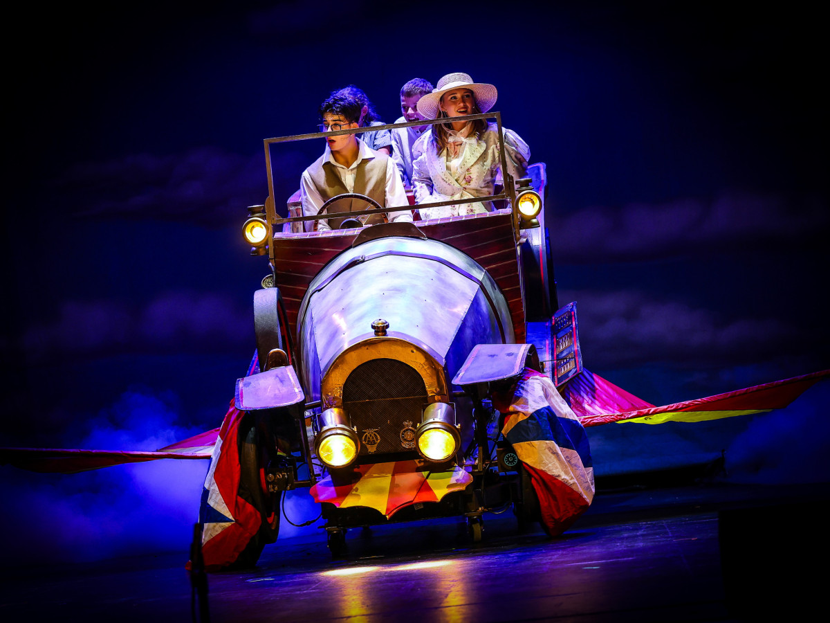 an image of Chitty Chitty Bang Bang the car with our cast inside