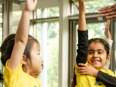 Child making friends in a performing arts class