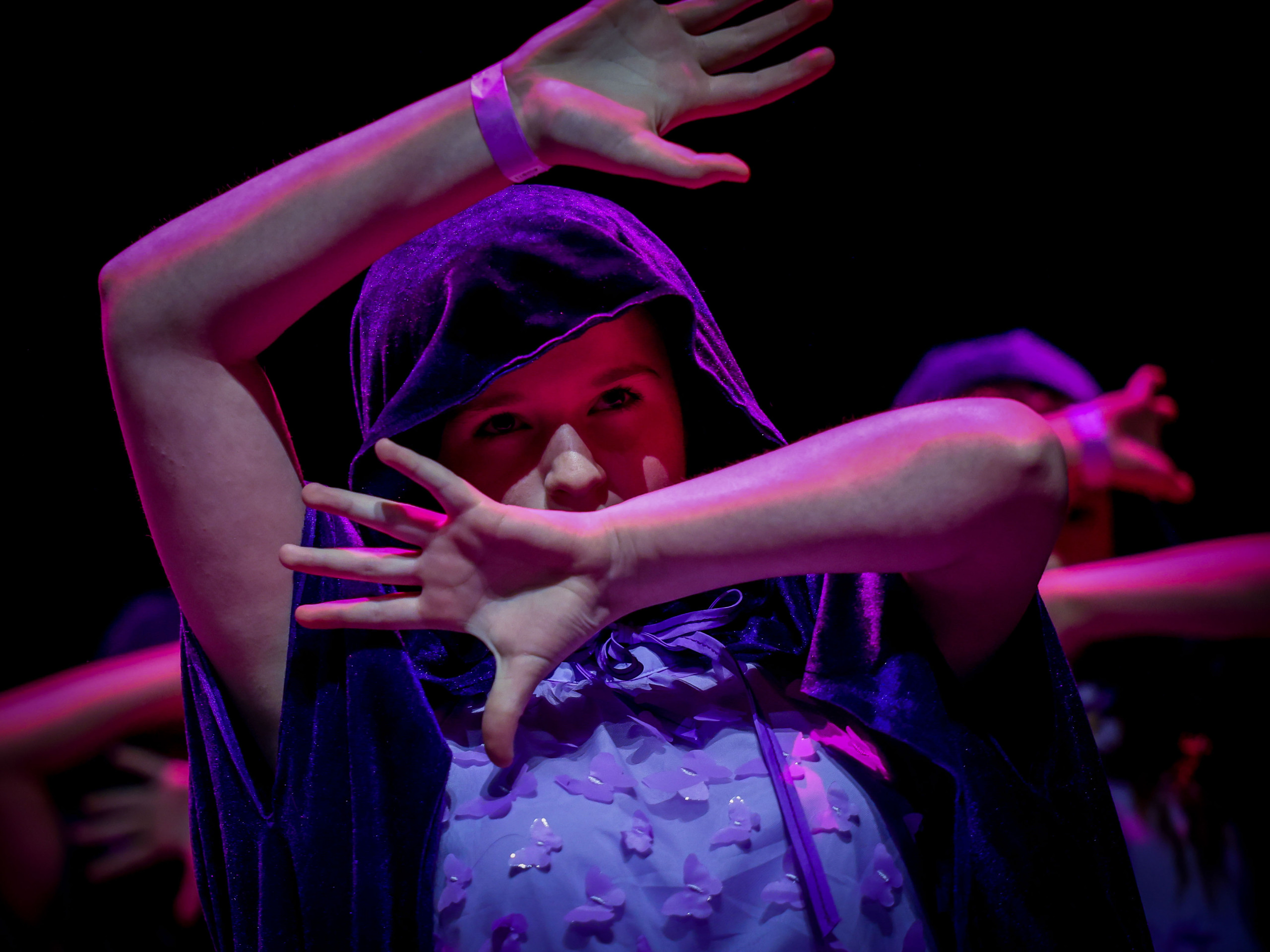 A young performer taking part in a Stagecoach production.